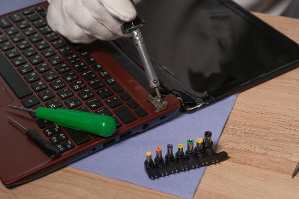 Repair of a notebook or laptop. Computer maintenance and repair pc. Repair of a notebook or laptop. Computer maintenance and repair pc. installing laptop ram stock pictures, royalty-free photos & images