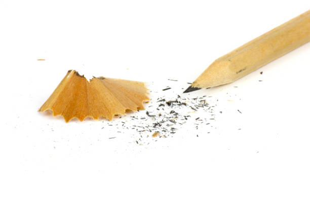 istock pencil and wood shavings on white Background. 1156873550