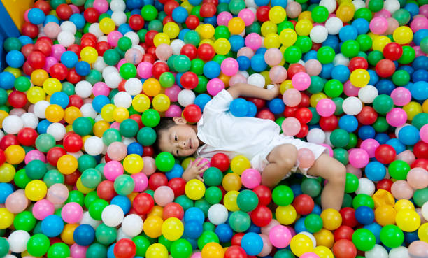 istock Four years old boy on the ball pool 1156874969