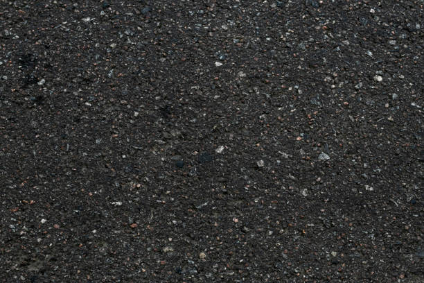 istock Asphalt textured background. Dark asphalt surface texture. Abstract close-up of black backdrop. Pattern of stone, gravel background. Copy space of grunge wall. Old road, roadway, bitumen street floor. 1156875640