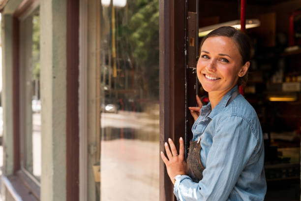 istock Young female entrepreneur working at her small workshop business 1156875819