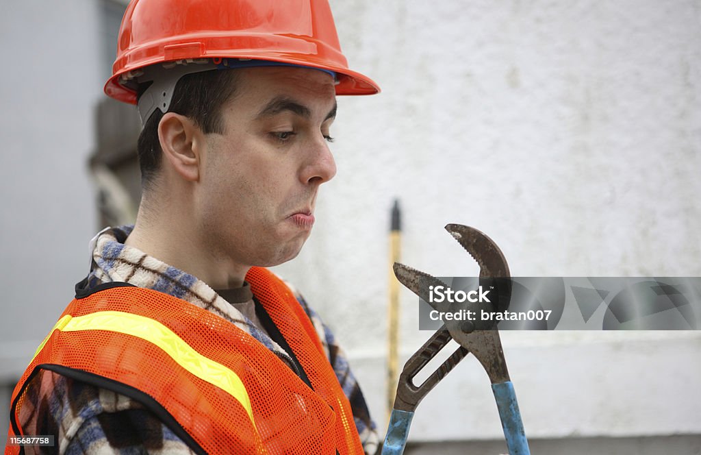 Man vs outil - Photo de Gilet de costume libre de droits