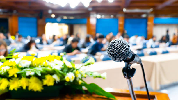 istock Microphone on stage for opening ceremony and performances. Blurring the movie scene 1156880387