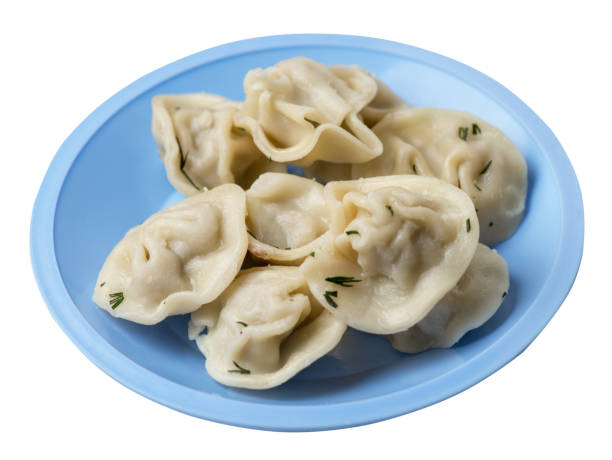 istock dumplings on a plate isolated on white background .meat dumplings top view . 1156881076