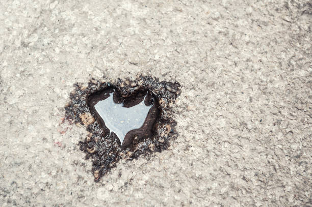 Shape of heart with water on the stone surface. Abstract love background