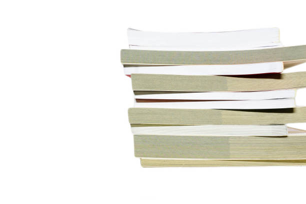 istock Books stacked on the table with white background 1156884569