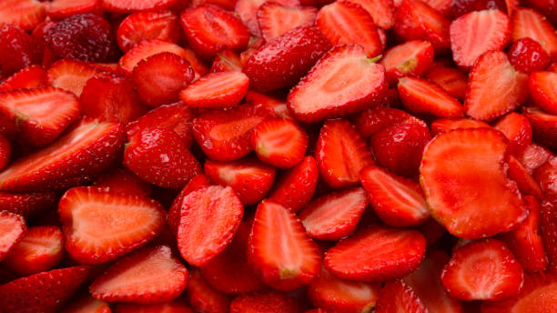 istock Strawberry slices. Fresh berries macro. Fruit background. Top view. 1156884658