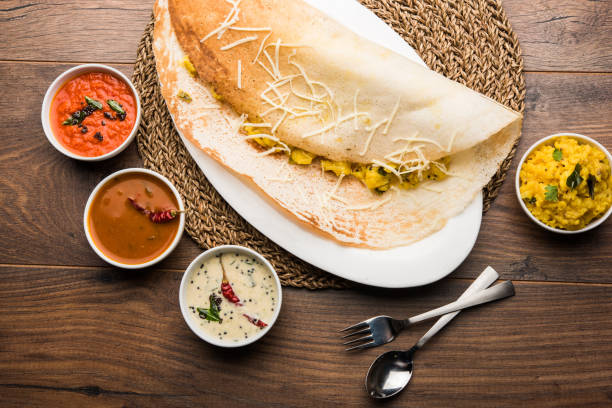 istock cheese masala dosa recipe with sambar and chutney, selective focus 1156886048