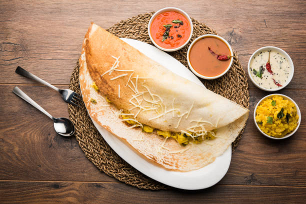 istock cheese masala dosa recipe with sambar and chutney, selective focus 1156886180