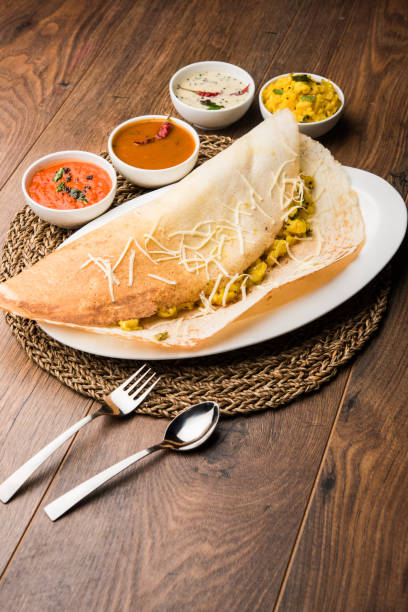 istock cheese masala dosa recipe with sambar and chutney, selective focus 1156886295