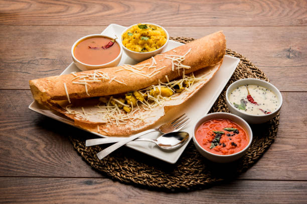 istock cheese masala dosa recipe with sambar and chutney, selective focus 1156886437