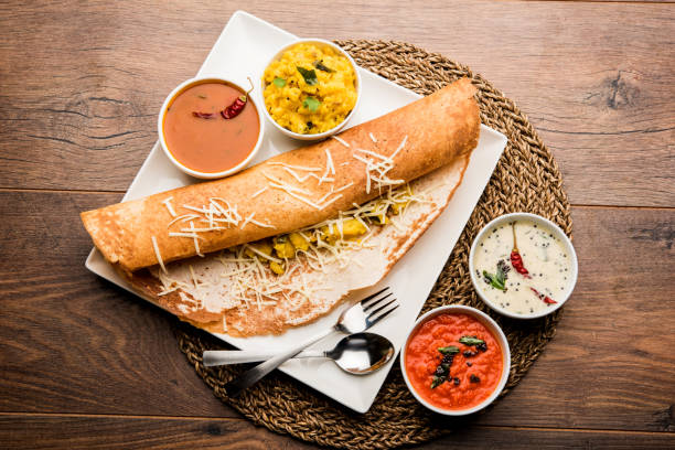 istock cheese masala dosa recipe with sambar and chutney, selective focus 1156887022