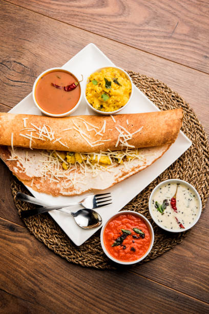 cheese masala dosa recipe with sambar and chutney, selective focus - dosa imagens e fotografias de stock