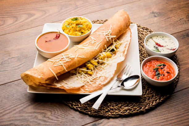 istock cheese masala dosa recipe with sambar and chutney, selective focus 1156887062
