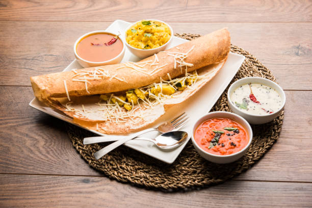 istock cheese masala dosa recipe with sambar and chutney, selective focus 1156887108