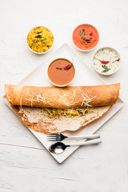 istock cheese masala dosa recipe with sambar and chutney, selective focus 1156887630