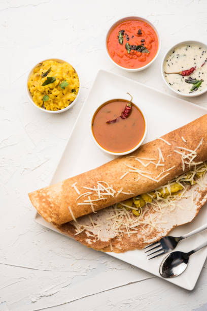 istock cheese masala dosa recipe with sambar and chutney, selective focus 1156887638