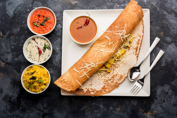 istock cheese masala dosa recipe with sambar and chutney, selective focus 1156887779