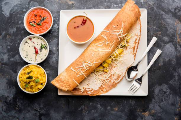 istock cheese masala dosa recipe with sambar and chutney, selective focus 1156887817
