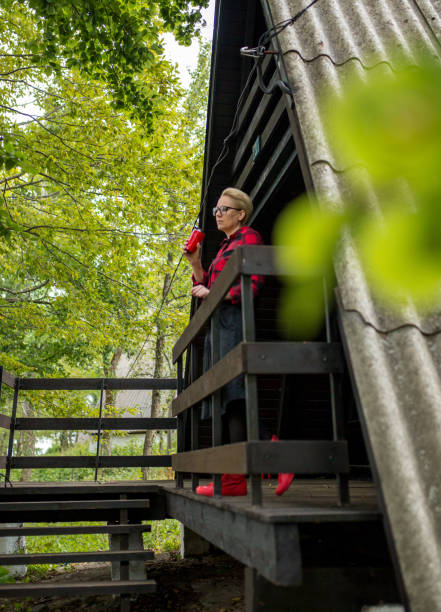 istock woman on an old porch 1156887888