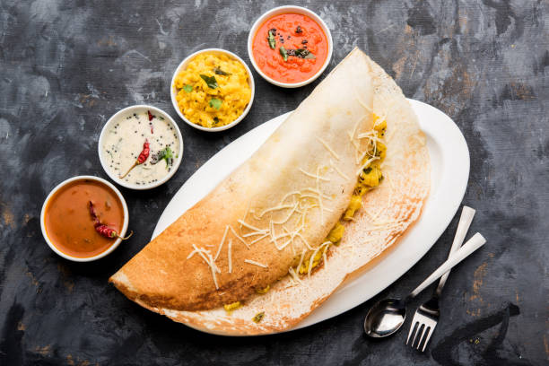 istock cheese masala dosa recipe with sambar and chutney, selective focus 1156888535