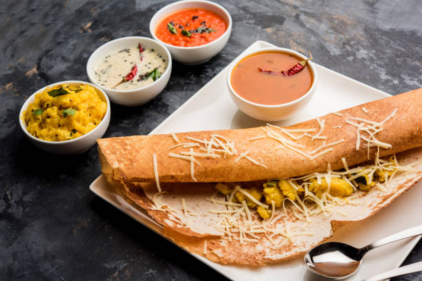 istock cheese masala dosa recipe with sambar and chutney, selective focus 1156888632