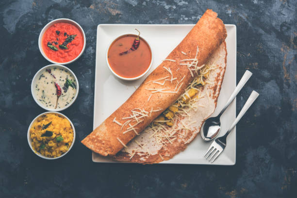 istock cheese masala dosa recipe with sambar and chutney, selective focus 1156888652