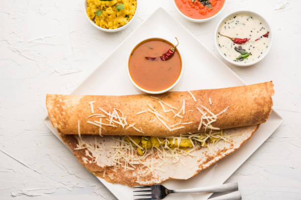 istock cheese masala dosa recipe with sambar and chutney, selective focus 1156888714