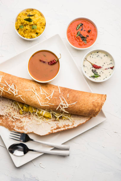 istock cheese masala dosa recipe with sambar and chutney, selective focus 1156888721