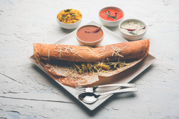 istock cheese masala dosa recipe with sambar and chutney, selective focus 1156888798