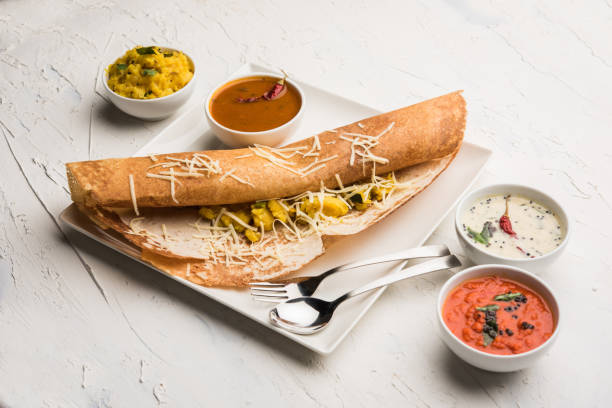 istock cheese masala dosa recipe with sambar and chutney, selective focus 1156888841