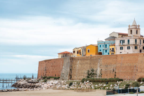 View from the beach on wall and buildings in Termoli city, Italy