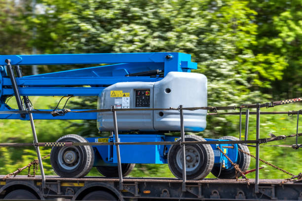 telescopic elevator lifting equipment in transporting progress on uk motorway