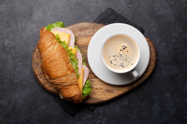 istock Coffee and croissant sandwich 1156891304