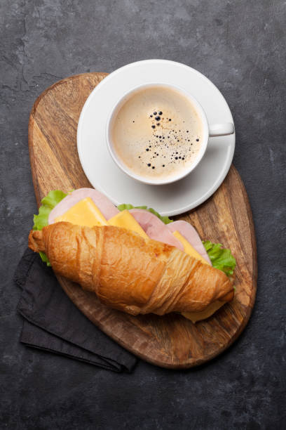 istock Coffee and croissant sandwich 1156891318