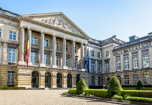 Three-quarter front view of the Palace of the Nation in Brussels, Belgium, seat of the Belgian Federal Parliament that shares the legislative power of the federal state with the King of the Belgians.