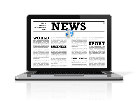 News on a laptop computer isolated on white with 2 clipping paths : one for global scene and one for the screen