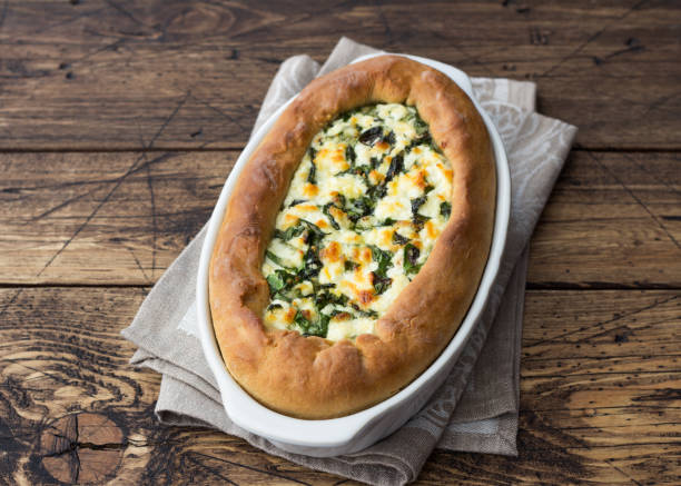 istock Open cheese pie with chard in Adjara style on the wooden table 1156894400