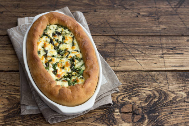 istock Open cheese pie with chard in Adjara style on the wooden table 1156894518
