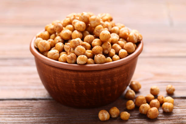 istock Roasted chickpeas in bowl on wooden table 1156895415