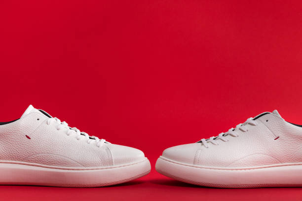 istock Men's shoes. White sneaker on background . 1156895780