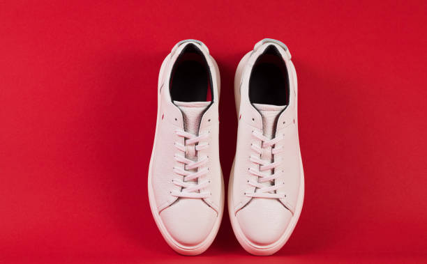 istock Men's shoes. White sneaker on background . 1156895786