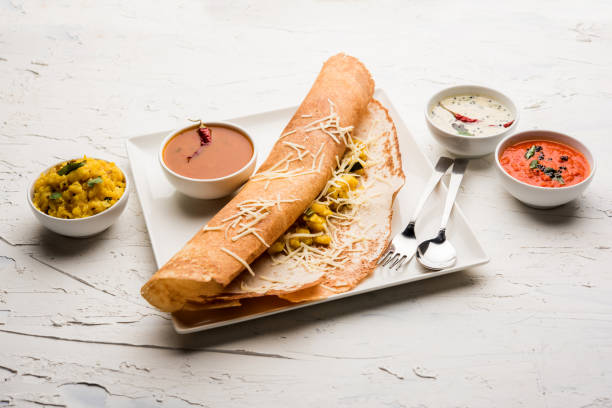 istock cheese masala dosa recipe with sambar and chutney, selective focus 1156895928