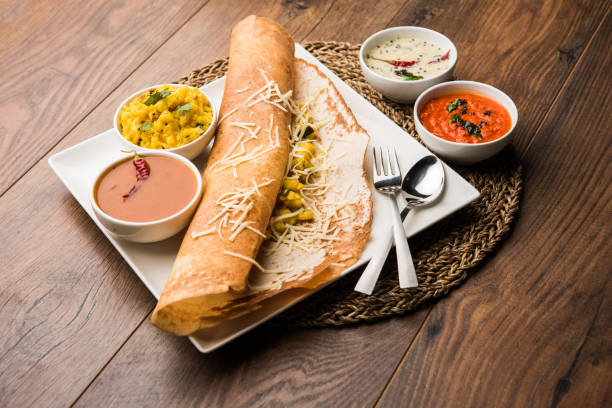 istock cheese masala dosa recipe with sambar and chutney, selective focus 1156895944