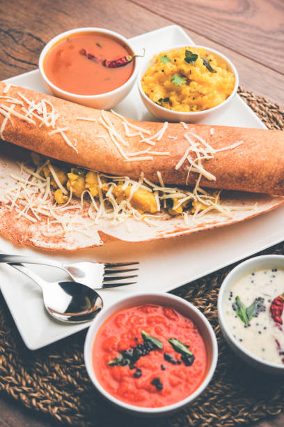 istock cheese masala dosa recipe with sambar and chutney, selective focus 1156895979