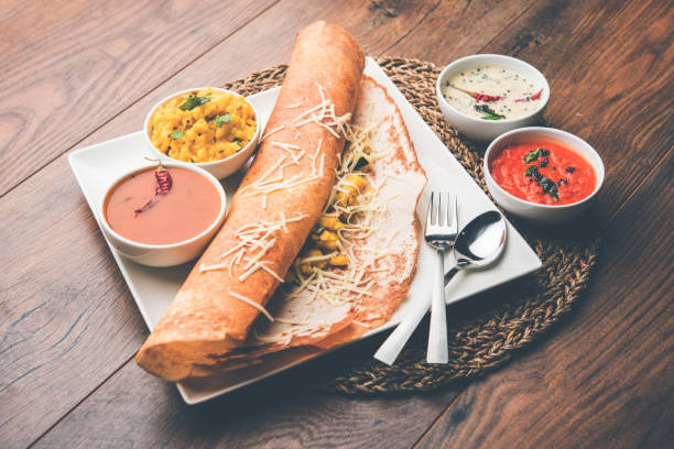 istock cheese masala dosa recipe with sambar and chutney, selective focus 1156896008