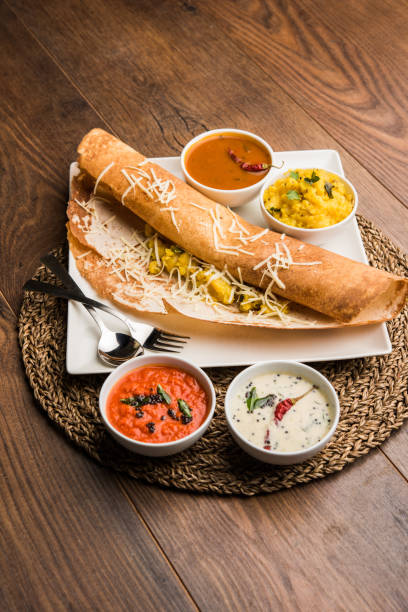 istock cheese masala dosa recipe with sambar and chutney, selective focus 1156896023