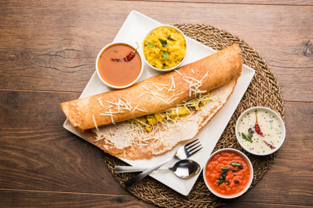 istock cheese masala dosa recipe with sambar and chutney, selective focus 1156896041