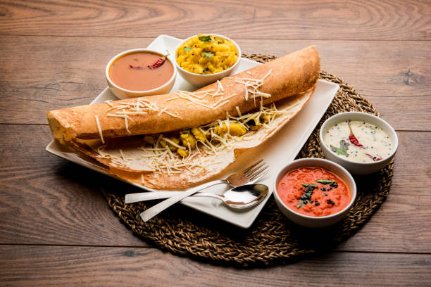cheese masala dosa recipe with sambar and chutney, selective focus cheese masala dosa recipe with sambar and chutney, selective focus chennai photos stock pictures, royalty-free photos & images