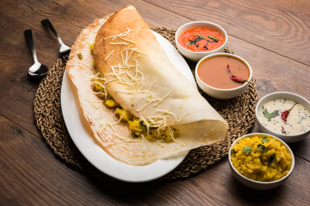istock cheese masala dosa recipe with sambar and chutney, selective focus 1156896243
